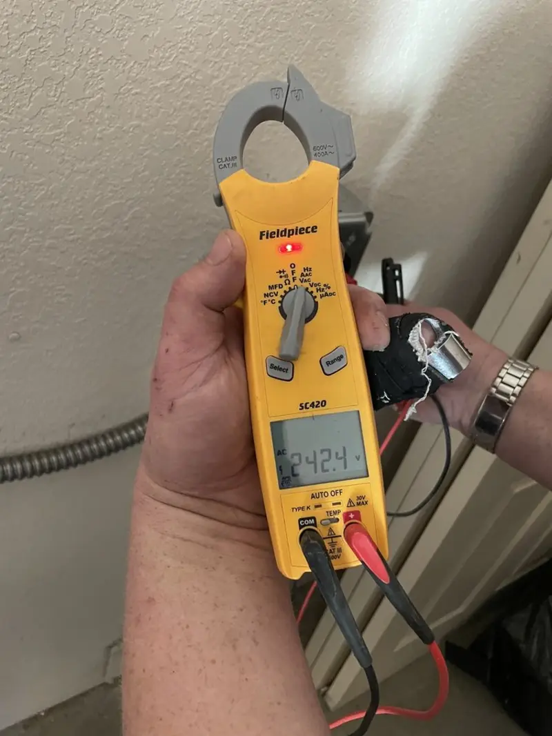 Voltage testing with clamp meter during Whole House Surge Protector in Meridian